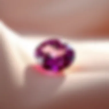 Ceylon pink sapphire displayed on elegant fabric