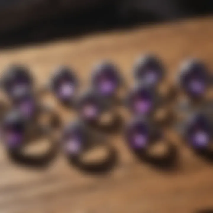 A collection of various amethyst rings displayed on a rustic wooden surface