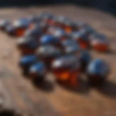 Rough black fire opal stones displayed on a wooden surface