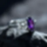 Diamond Ring with Amethyst Accent A stunning diamond ring featuring a rich amethyst side stone