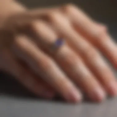 A beautifully crafted ring next to a finger sizer