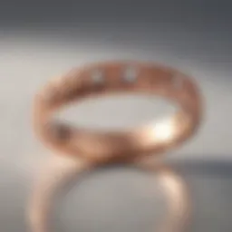 Elegant rose gold wedding band on a smooth surface