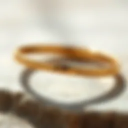 A close-up view of a sleek skinny gold band ring highlighting its craftsmanship