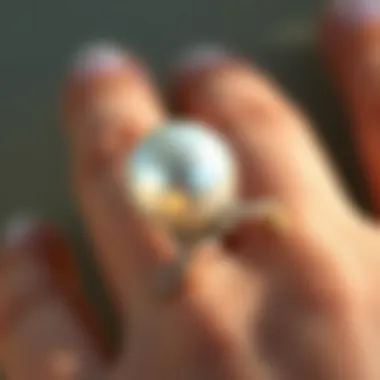 Pearl Elegance: The June Birth Ring A stunning June birth ring featuring a lustrous pearl set in a delicate band