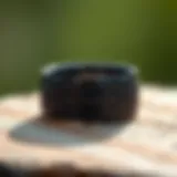 Elegant black titanium wedding band with intricate engraving