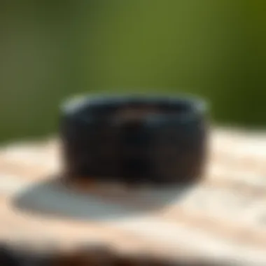 Elegant black titanium wedding band with intricate engraving