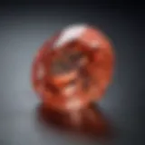 A stunning natural padparadscha sapphire displaying its unique color spectrum