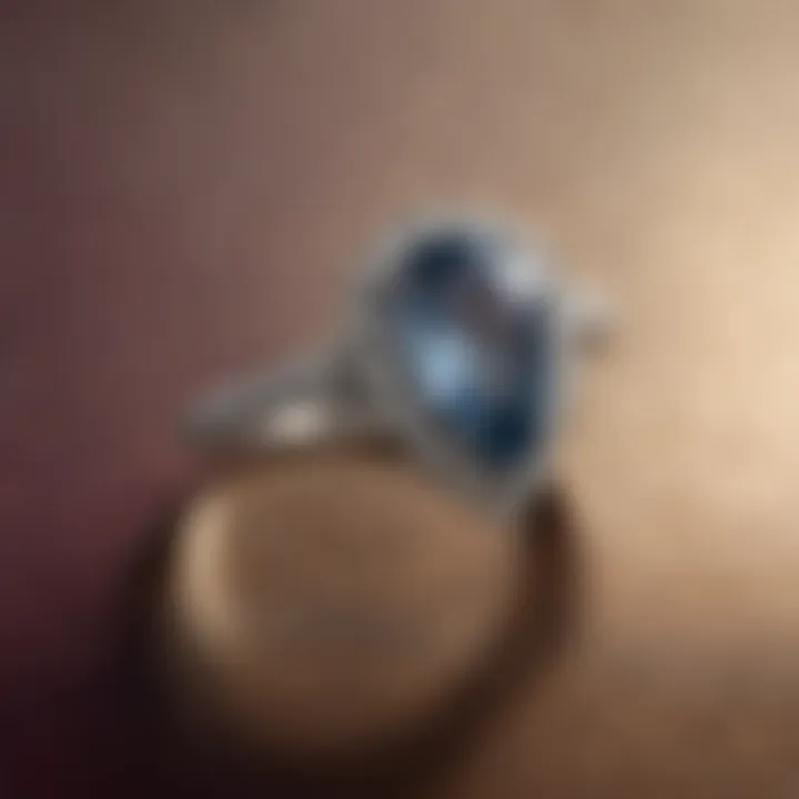 A mesmerizing teardrop engagement ring set against a soft velvet backdrop